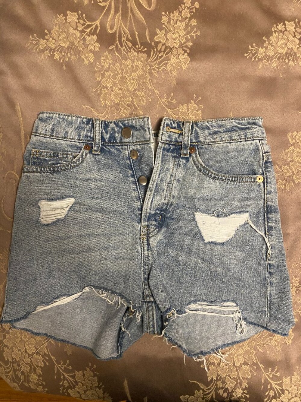 faded blue ripped denim shorts
